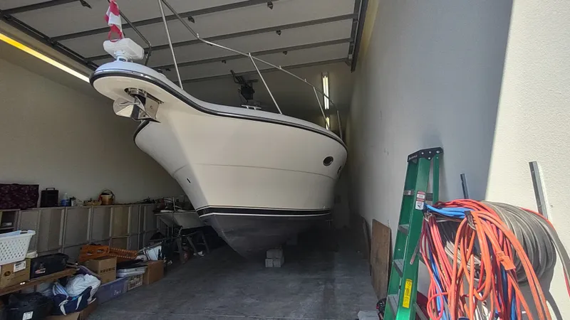  Yacht Photos Pics 2000 Tiara Yachts 3500 Open stored in a garage with equipment.