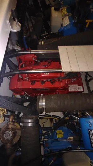  Yacht Photos Pics Engine compartment of a 2000 Tiara Yachts 3500 Open, featuring a red engine.