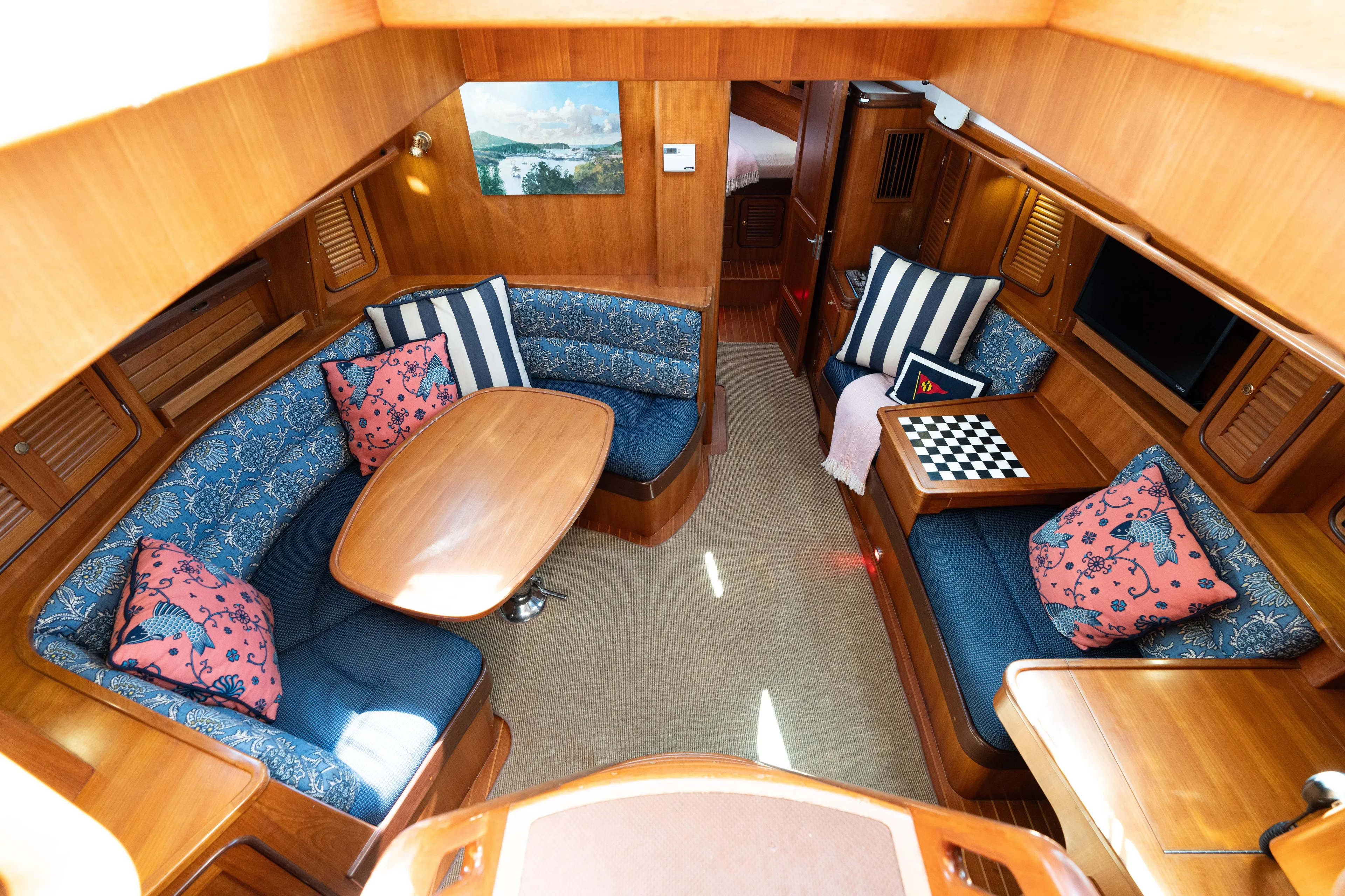 Altair Yacht Photos Pics Luxurious interior of 2002 Passport 470 Center Cockpit Ketch with elegant seating and decor.