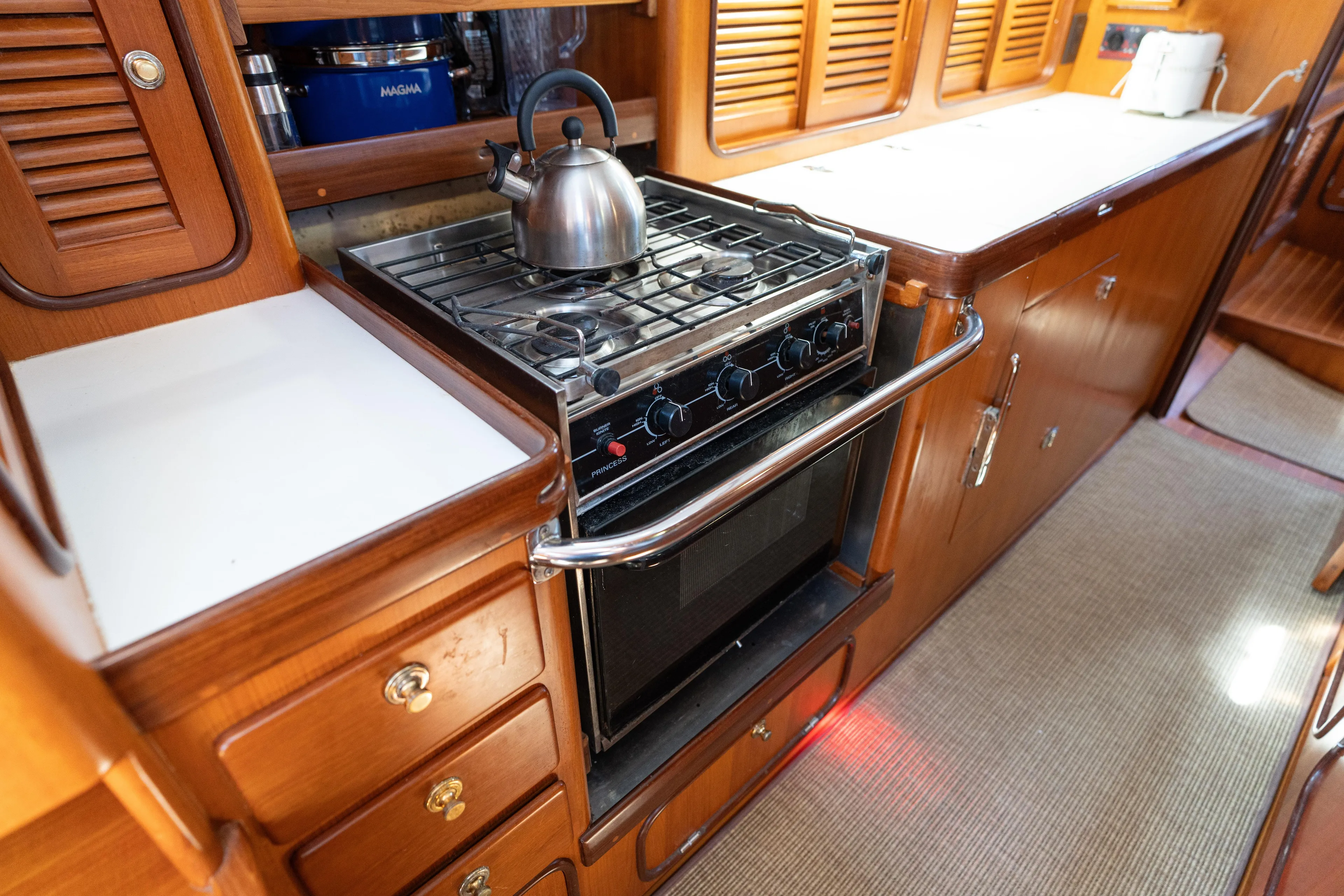 Altair Yacht Photos Pics Galley kitchen in 2002 Passport 470 Center Cockpit Ketch with stove and kettle.