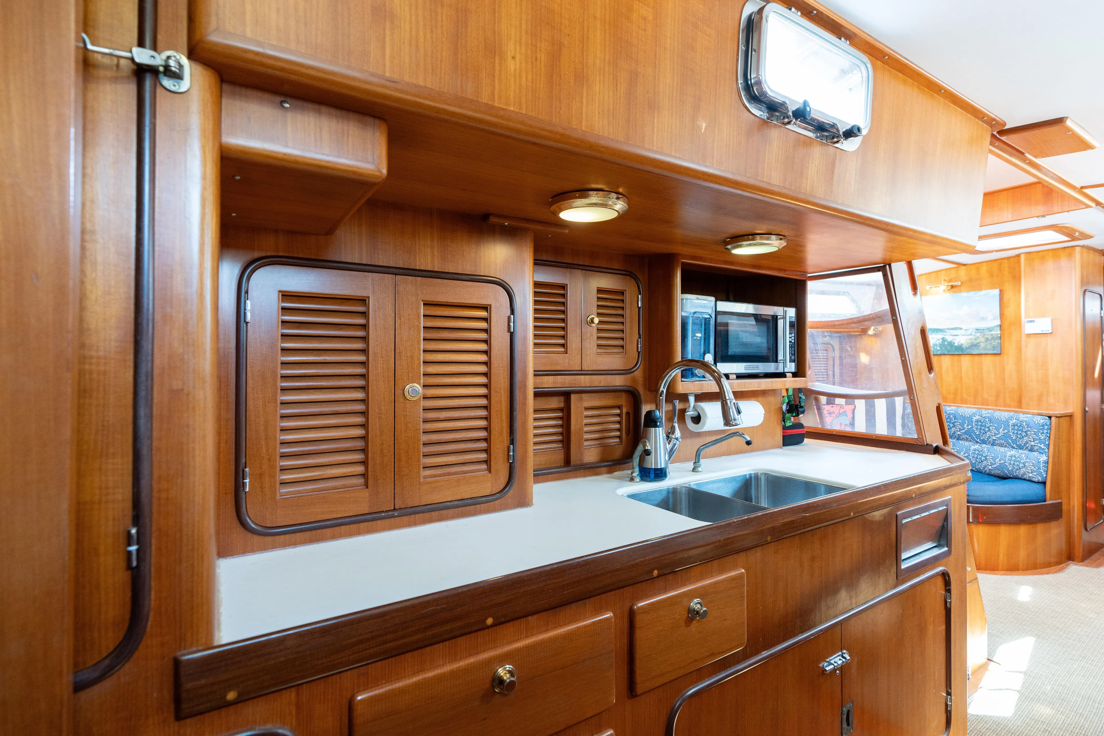 Altair Yacht Photos Pics Luxurious wooden interior of 2002 Passport 470 Center Cockpit Ketch yacht kitchen.