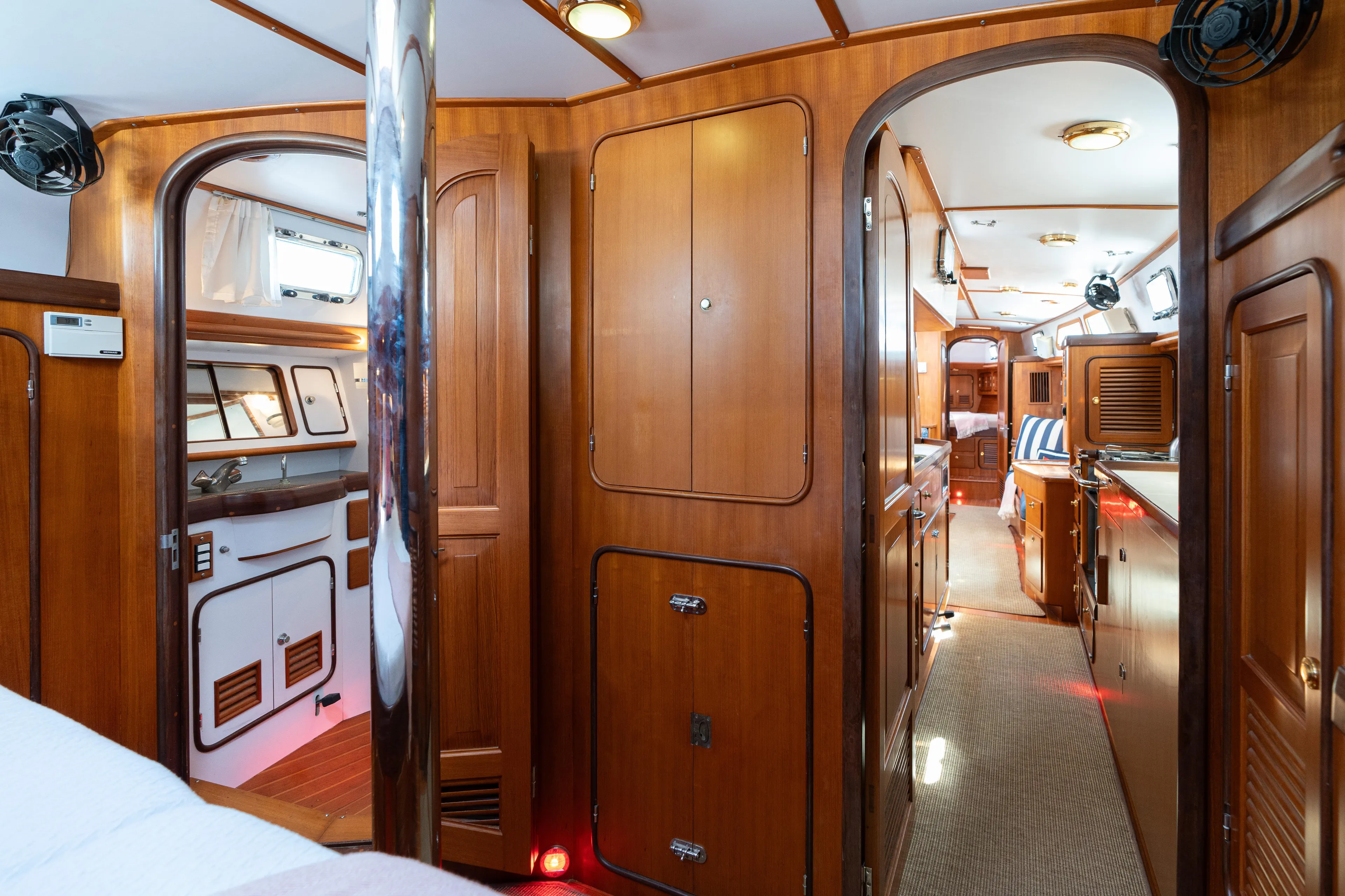 Altair Yacht Photos Pics Interior of 2002 Passport 470 Center Cockpit Ketch, featuring elegant wood paneling and modern amenities.