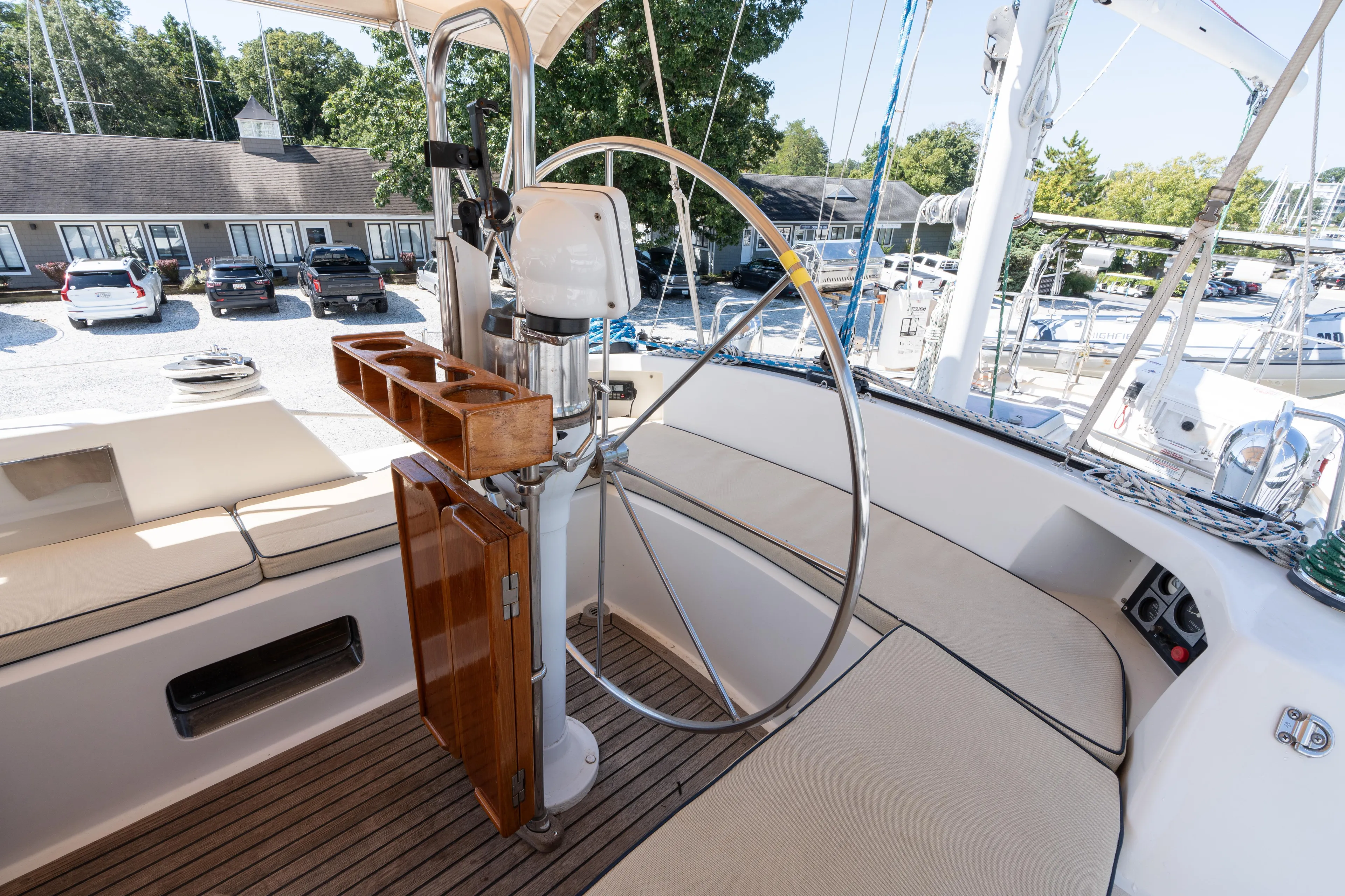 Altair Yacht Photos Pics Cockpit of 2002 Passport 470 Center Cockpit Ketch with steering wheel and seating.