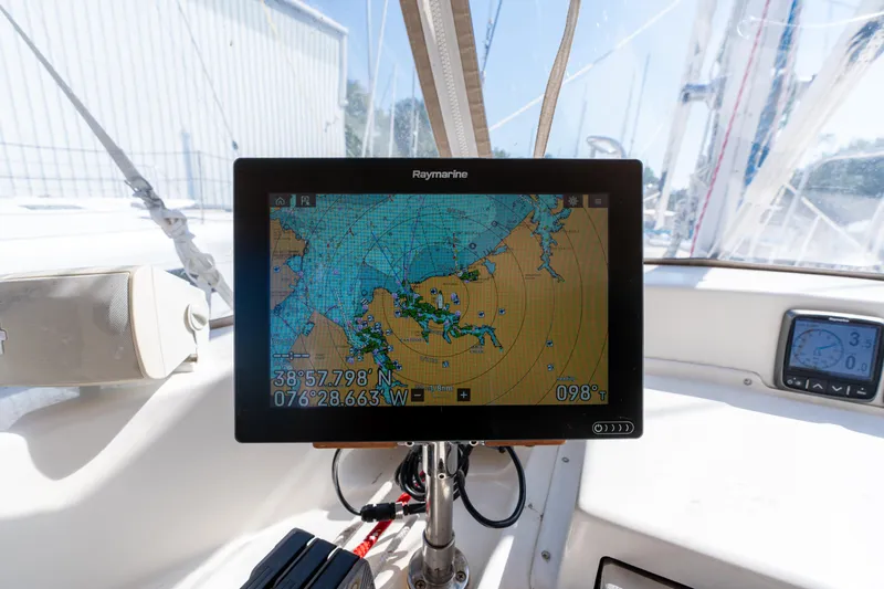 Altair Yacht Photos Pics Navigation system on 2002 Passport 470 Center Cockpit Ketch sailboat, displaying nautical chart.