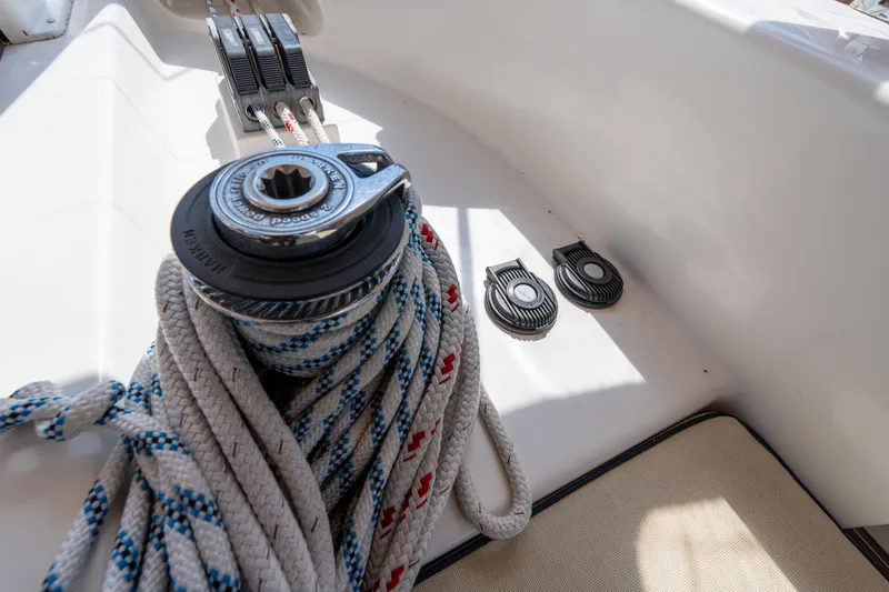 Altair Yacht Photos Pics Winch and ropes on 2002 Passport 470 Center Cockpit Ketch sailboat deck.