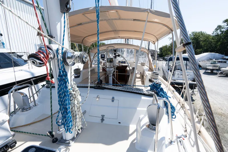 Altair Yacht Photos Pics 2002 Passport 470 Center Cockpit Ketch sailboat with ropes and winches on deck.