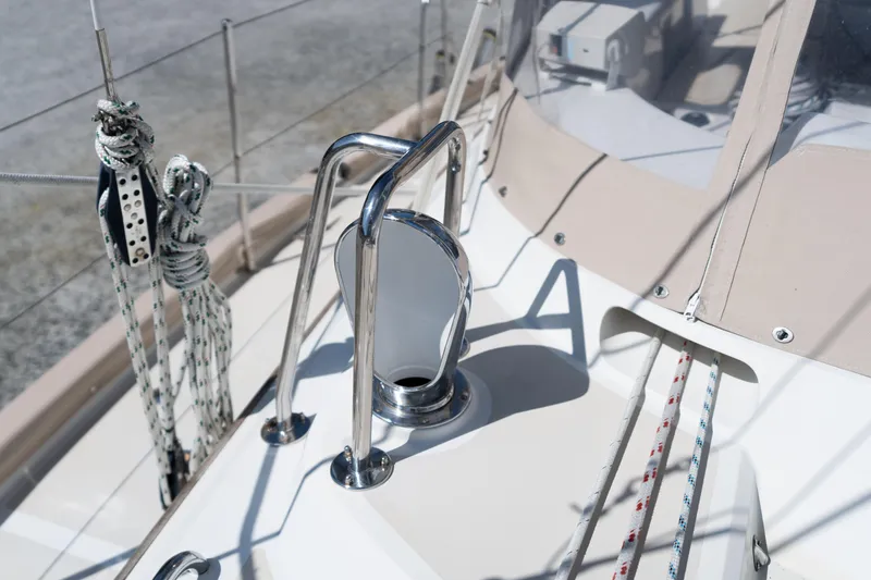 Altair Yacht Photos Pics Passport 470 Center Cockpit Ketch 2002 deck with ropes and chrome fittings.