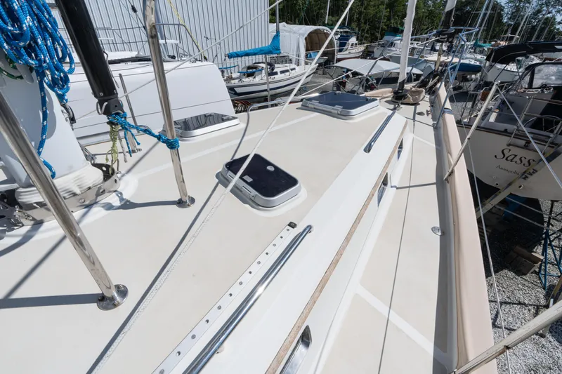 Altair Yacht Photos Pics Deck view of 2002 Passport 470 Center Cockpit Ketch, showcasing rigging and hatches.
