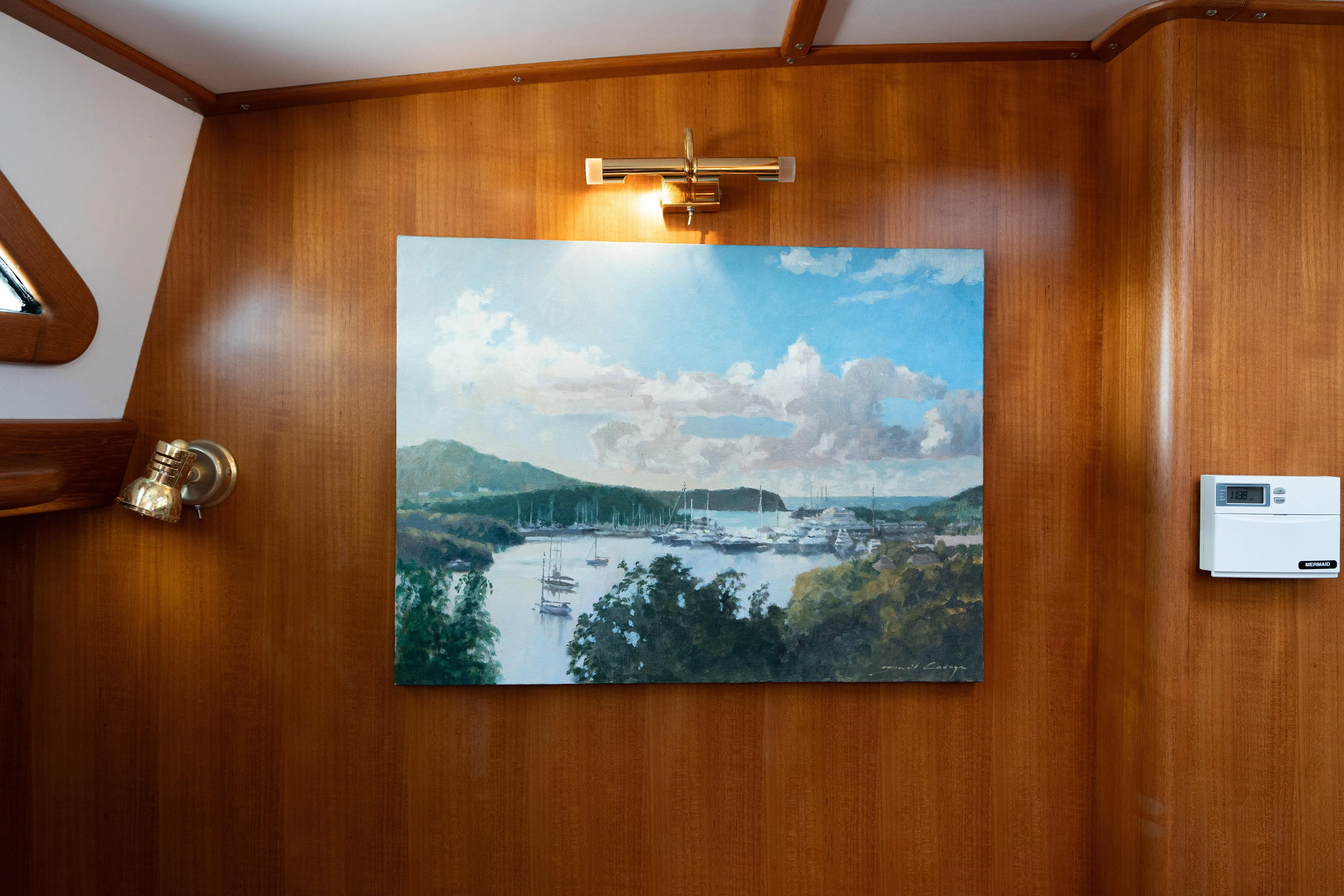 Altair Yacht Photos Pics Interior of 2002 Passport 470 Center Cockpit Ketch with landscape painting on wooden wall.