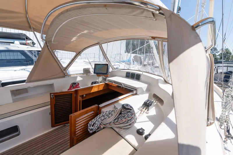 Altair Yacht Photos Pics 2002 Passport 470 Center Cockpit Ketch interior with navigation equipment and ropes.