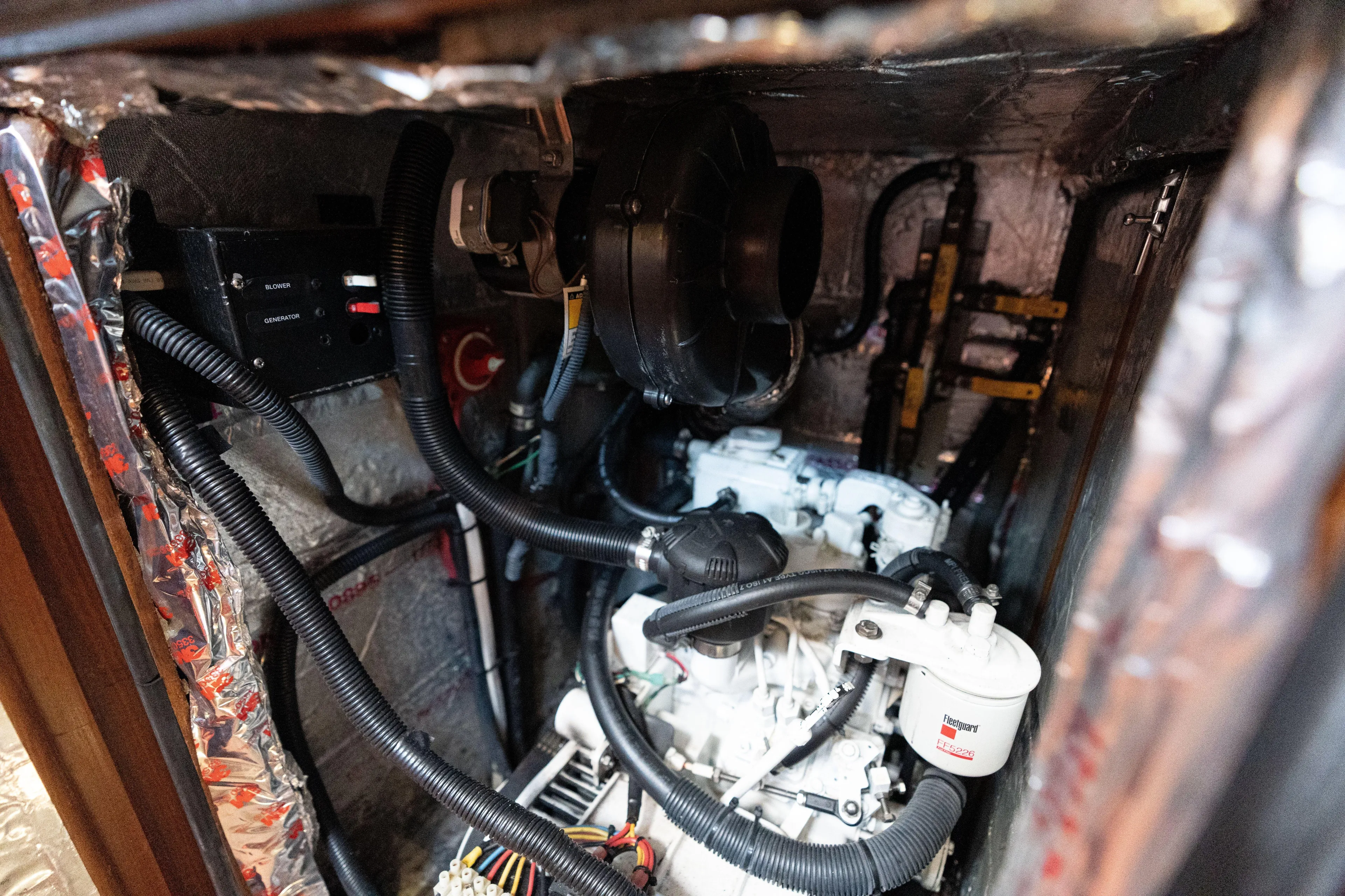 Altair Yacht Photos Pics Engine room of 2002 Passport 470 Center Cockpit Ketch with visible wiring and components.