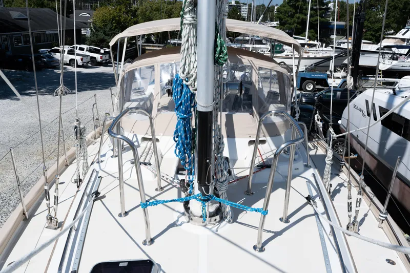 Altair Yacht Photos Pics 2002 Passport 470 Center Cockpit Ketch sailboat docked, showcasing deck and rigging details.