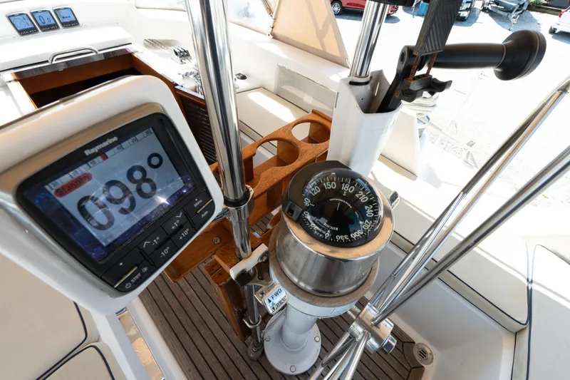 Altair Yacht Photos Pics Cockpit of 2002 Passport 470 Center Cockpit Ketch with compass and navigation display.