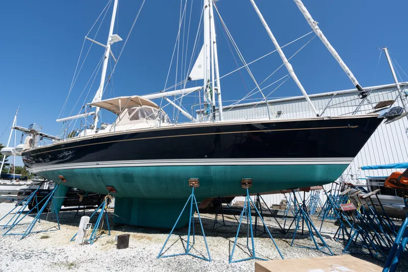 Altair Yacht Photos Pics 2002 Passport 470 Center Cockpit Ketch sailboat on stands in a boatyard.
