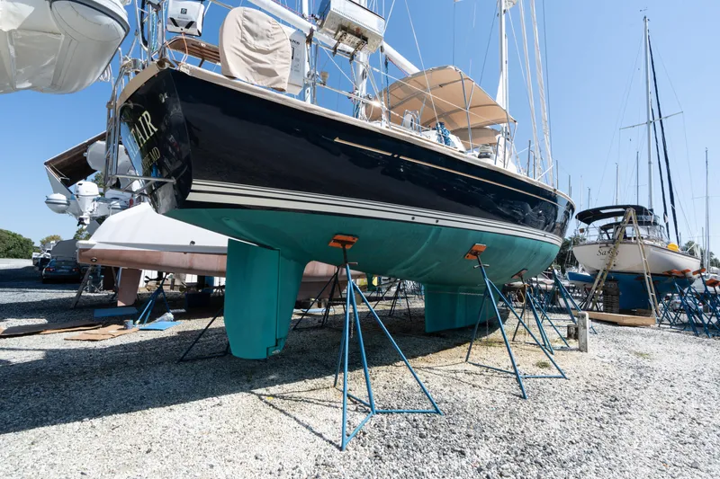 Altair Yacht Photos Pics 2002 Passport 470 Center Cockpit Ketch sailboat on stands in a boatyard.