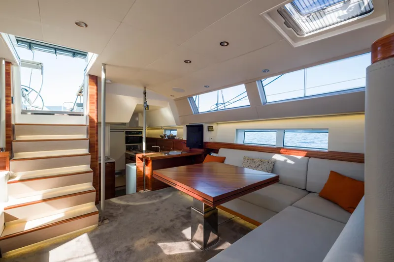 Dream On Yacht Photos Pics Luxurious interior of 2021 CNB 66 yacht with modern seating and dining area.