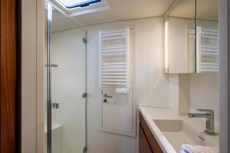 Dream On Yacht Photos Pics Modern bathroom in 2021 CNB 66 yacht with glass shower and sleek fixtures.