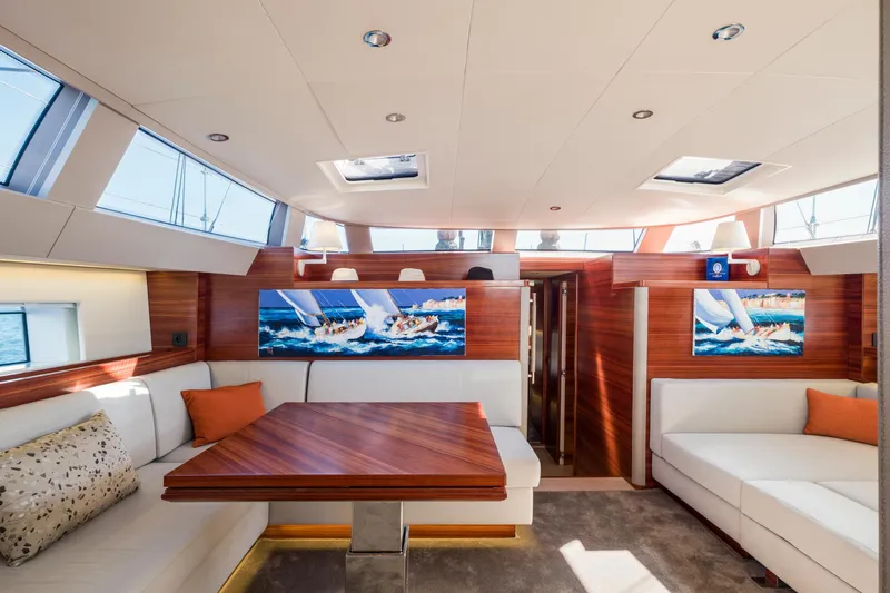 Dream On Yacht Photos Pics Luxurious CNB 66 yacht interior, 2021 model, featuring elegant wood finishes and plush seating.