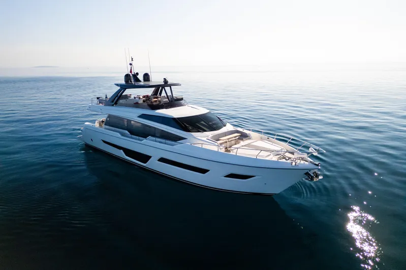 Dogu Yacht Photos Pics Luxurious 2021 Ferretti Yachts 780 cruising on calm, sunlit waters.