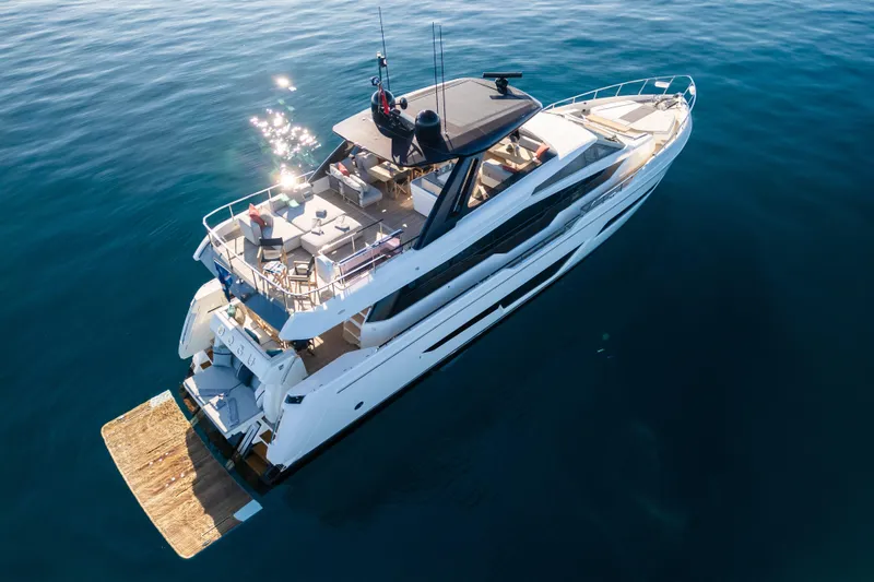 Dogu Yacht Photos Pics Luxurious 2021 Ferretti Yachts 780 cruising on calm blue waters.
