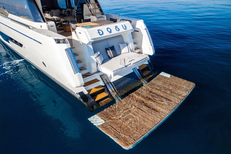 Dogu Yacht Photos Pics Ferretti Yachts 780, 2021 model, featuring a luxurious swim platform on calm blue waters.