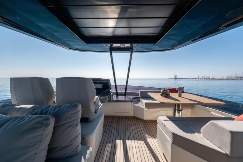 Dogu Yacht Photos Pics Luxurious 2021 Ferretti Yachts 780 interior with ocean view, featuring elegant seating and table.