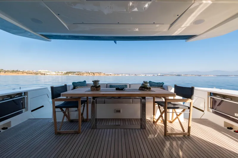 Dogu Yacht Photos Pics Luxurious 2021 Ferretti Yachts 780 deck with elegant outdoor dining setup.