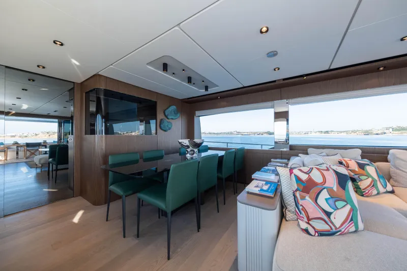 Dogu Yacht Photos Pics Luxurious interior of 2021 Ferretti Yachts 780 with elegant dining area and scenic views.
