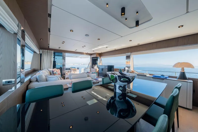 Dogu Yacht Photos Pics Luxurious interior of 2021 Ferretti Yachts 780 with modern furnishings and ocean view.