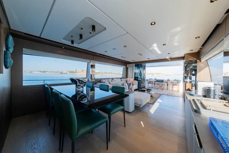 Dogu Yacht Photos Pics Luxurious interior of 2021 Ferretti Yachts 780 with ocean view and modern furnishings.