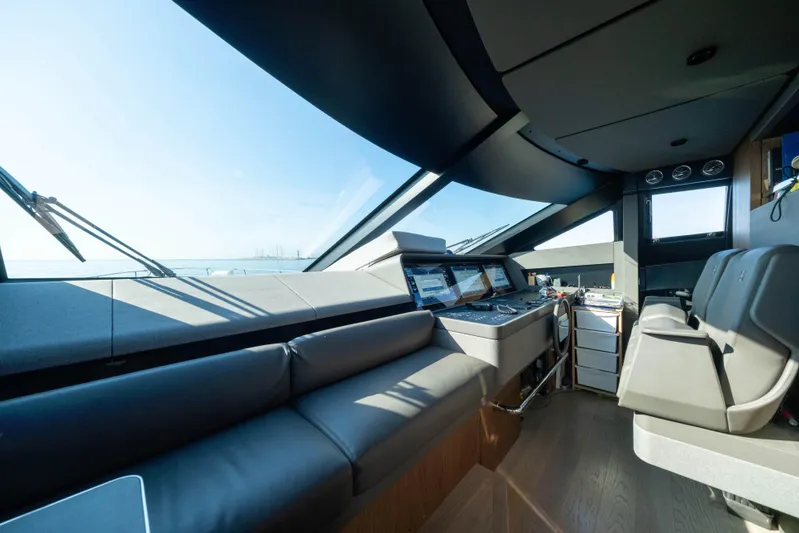 Dogu Yacht Photos Pics Luxurious interior of 2021 Ferretti Yachts 780 with modern navigation equipment.