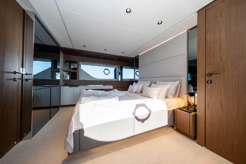 Dogu Yacht Photos Pics Luxurious bedroom interior of 2021 Ferretti Yachts 780 with modern design and elegant furnishings.