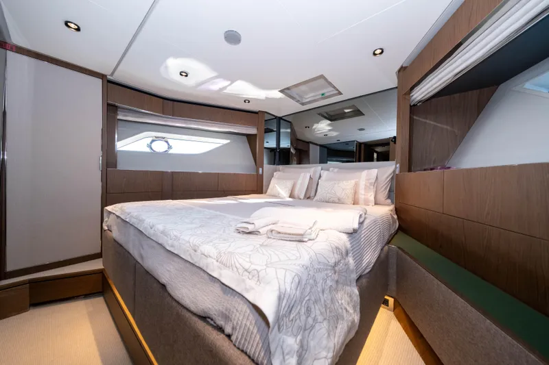Dogu Yacht Photos Pics Luxurious bedroom interior of 2021 Ferretti Yachts 780 with modern design and elegant furnishings.