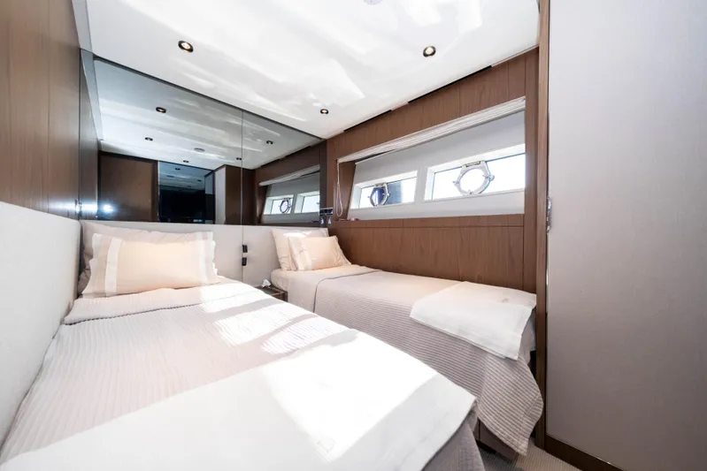 Dogu Yacht Photos Pics Luxurious twin bedroom in 2021 Ferretti Yachts 780, featuring modern design and natural light.