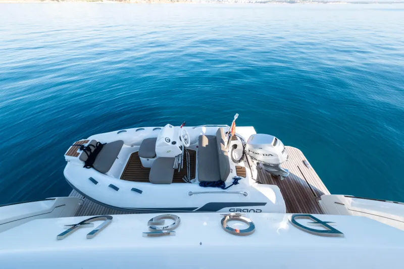 Dogu Yacht Photos Pics Luxury Ferretti Yachts 780, 2021 model, with tender on serene blue water.