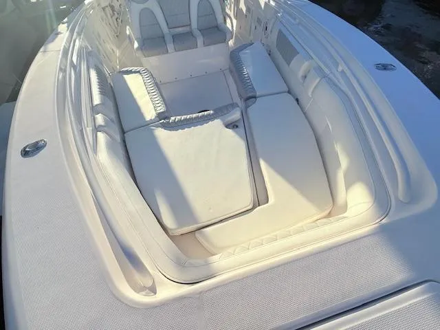  Yacht Photos Pics 2014 Everglades 355 Center Console boat with spacious seating area and cushions.