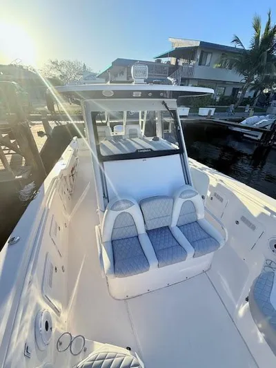  Yacht Photos Pics 2014 Everglades 355 Center Console boat docked in sunny marina.