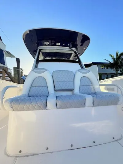  Yacht Photos Pics 2014 Everglades 355 Center Console boat with cushioned seating and sleek design.