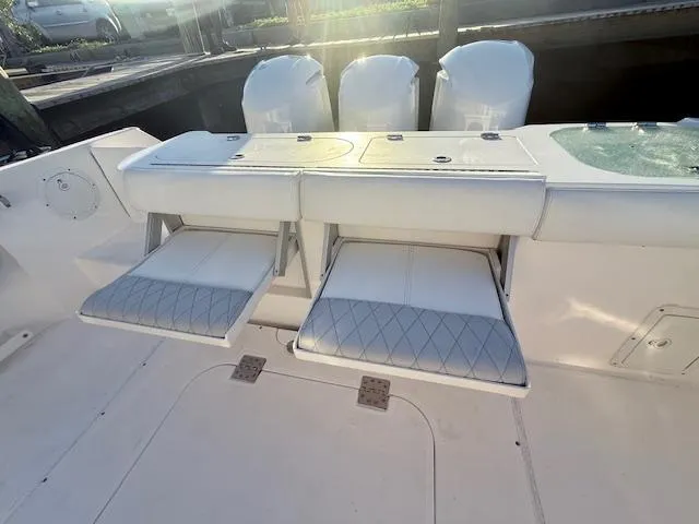  Yacht Photos Pics 2014 Everglades 355 Center Console boat with foldable seats and triple engines.