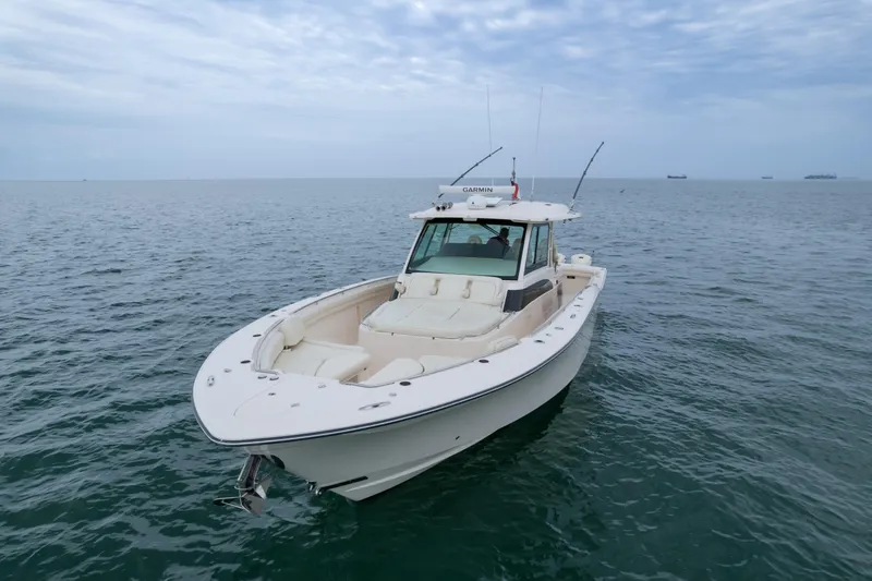  Yacht Photos Pics 2020 Grady-White Canyon 456 boat on open sea under cloudy sky.