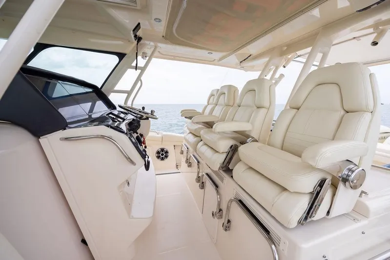  Yacht Photos Pics Luxurious interior of 2020 Grady-White Canyon 456 boat with plush seating and helm.
