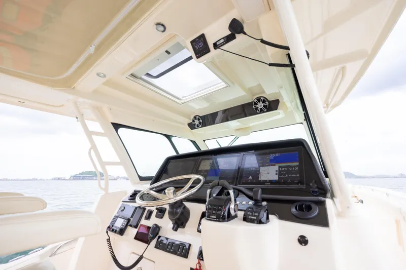  Yacht Photos Pics 2020 Grady-White Canyon 456 boat helm with advanced navigation systems and controls.