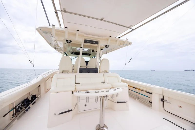  Yacht Photos Pics 2020 Grady-White Canyon 456 boat interior with seating, ocean view, and fishing rods.