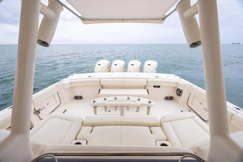  Yacht Photos Pics 2020 Grady-White Canyon 456 boat interior with ocean view, featuring luxurious seating and multiple engines.