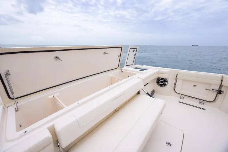  Yacht Photos Pics 2020 Grady-White Canyon 456 boat interior with open storage, ocean view.