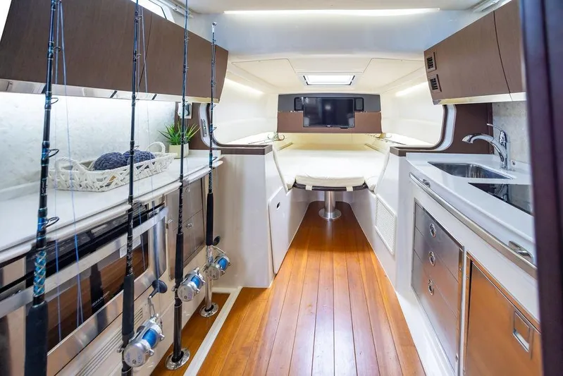  Yacht Photos Pics Interior of 2020 Grady-White Canyon 456 boat with fishing rods and modern amenities.