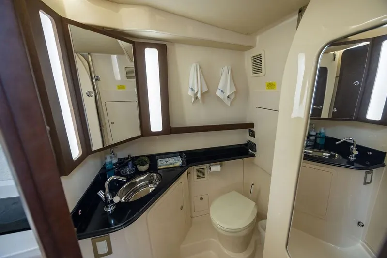  Yacht Photos Pics Luxurious bathroom interior of 2020 Grady-White Canyon 456 boat, featuring modern fixtures.