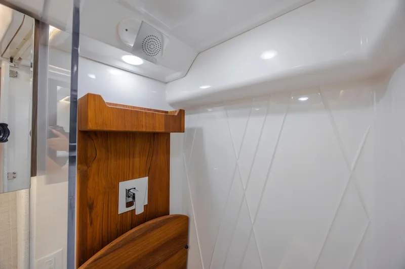  Yacht Photos Pics Interior of 2022 Regal 36 Grande Coupe, featuring modern wood and white paneling.