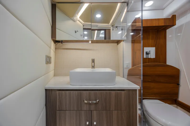  Yacht Photos Pics Luxurious bathroom interior of 2022 Regal 36 Grande Coupe yacht.