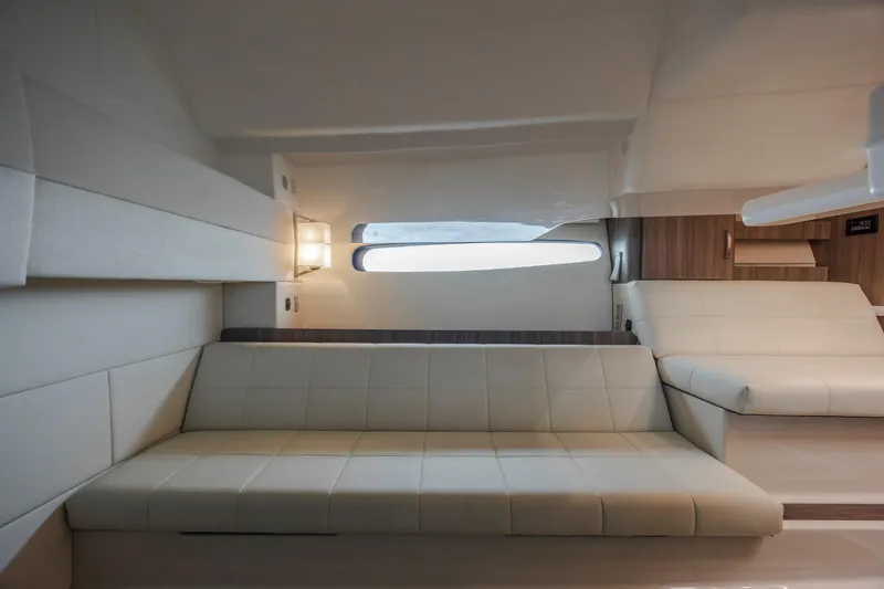  Yacht Photos Pics 2022 Regal 36 Grande Coupe interior with modern seating and sleek design.